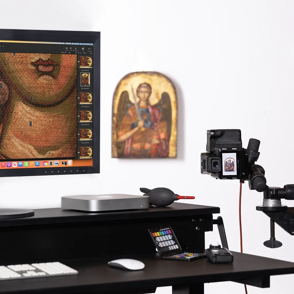 Artwork positioned on the capture wall while a medium-format camera records it under even, controlled light